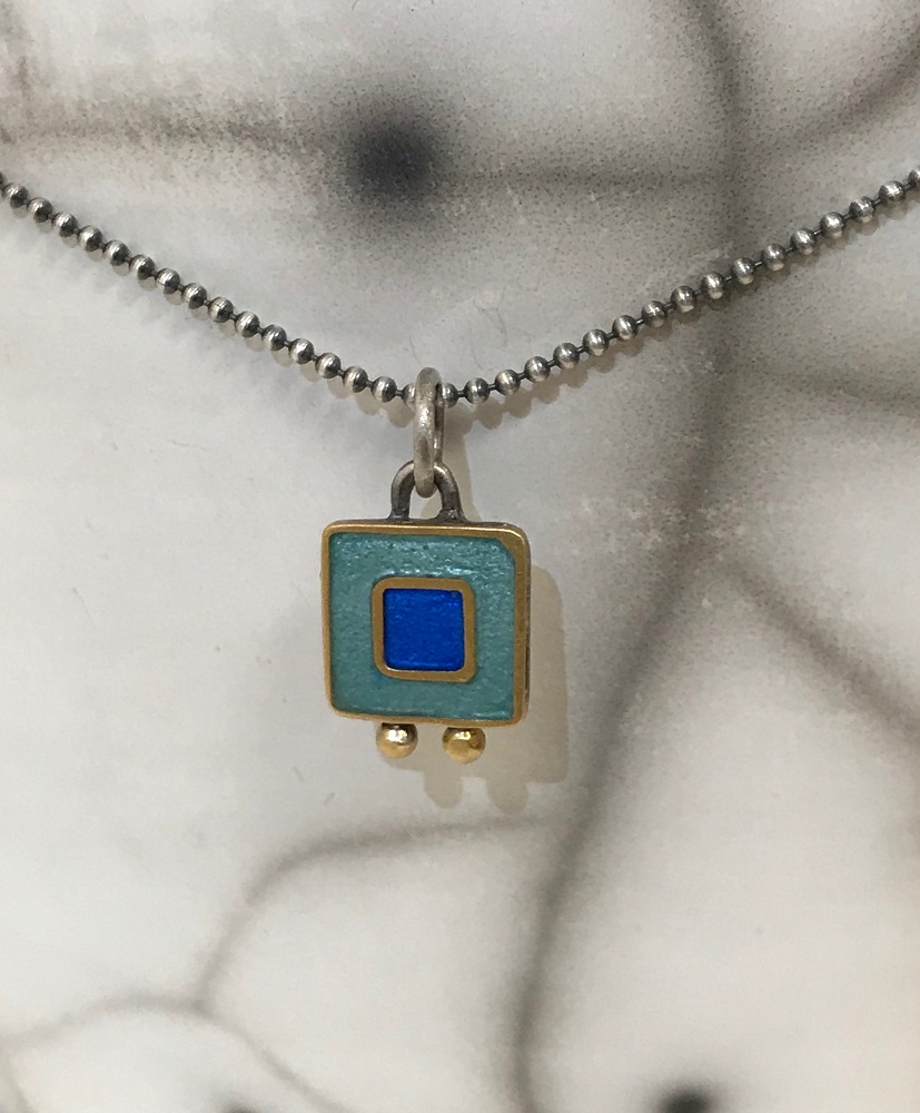Necklace - Silver grey, bright blue square with two gold balls. 